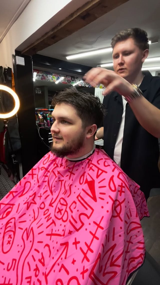 Zac styling a client’s hair at Black Panther